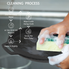 Cleaning process of a cast iron skillet with a hand using a sponge and text instructions.