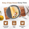 Frying pan with dosa and ingredients on a wooden board, with text about dosa making.
