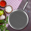 Metal strainer on a checkered tablecloth with ingredients like peppers, garlic, and spices.