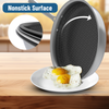 Nonstick frying pan with eggs on a plate, emphasizing the nonstick surface.