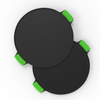 Two round griddle plates with green handles on a white background