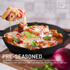 Pre-seasoned cast iron skillet with cheesy pasta and basil leaves, brand logo visible.