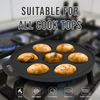 Black cast iron skillet with muffins on a stove, suitable for various cooktop types.