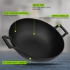 Black cast iron wok with features highlighted on a gray background