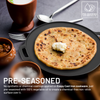Pre-seasoned cast iron skillet with a flatbread and butter, surrounded by ceramic bowls and utensils.