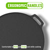 Black cast iron skillet with ergonomic handles on a white background
