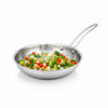 Stainless steel frying pan with mixed vegetables on a white background