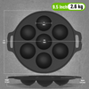 Black round baking pan with measurements on a gray background
