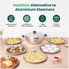 Stainless steel cookware set with food on a wooden table, featuring icons and text about its benefits.