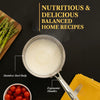 Stainless steel pot with boiling liquid, asparagus, cherry tomatoes, and a fork on a black background with text about balanced home recipes.
