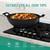 Black wok with food on a gas stove, suitable for all cook tops.